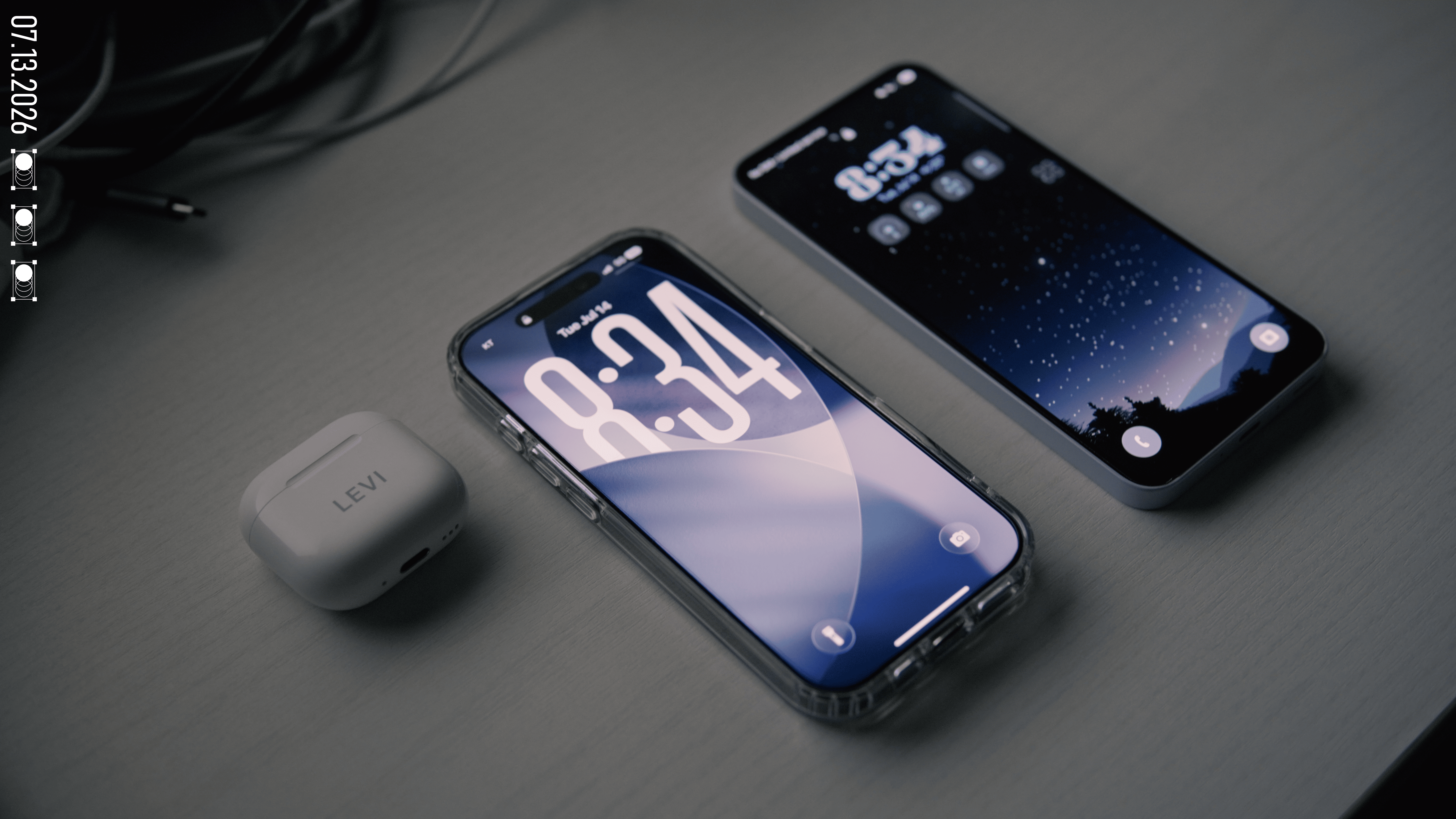 The same three laid out at an angle, the AirPods case in front